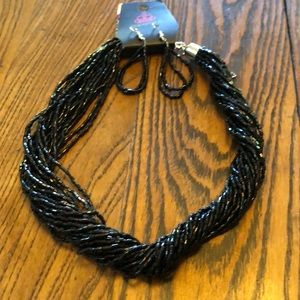 NWT. Black beaded chocker with matching pierced earrings.